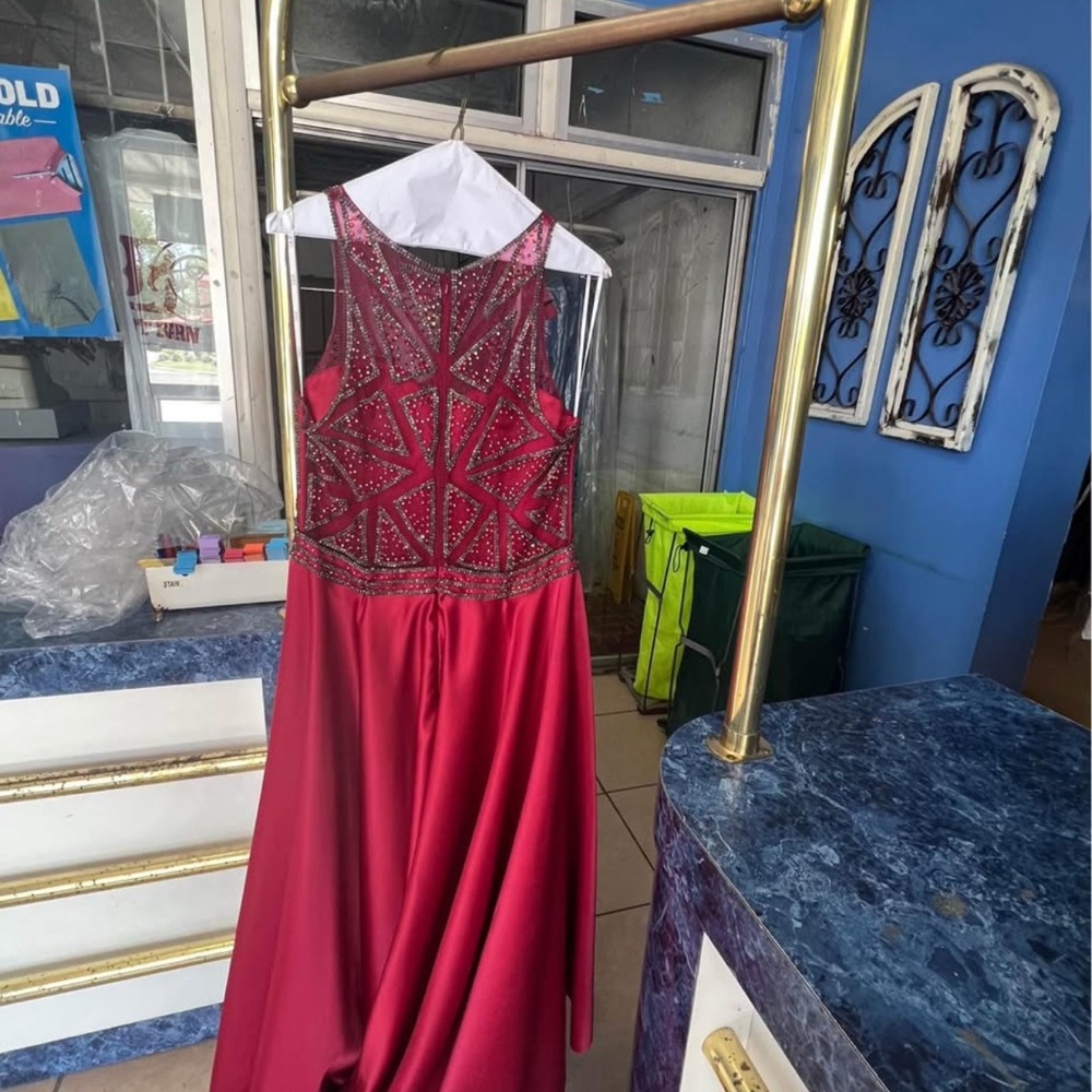 Elegant Red Sleeveless Gown with Beaded Bodice